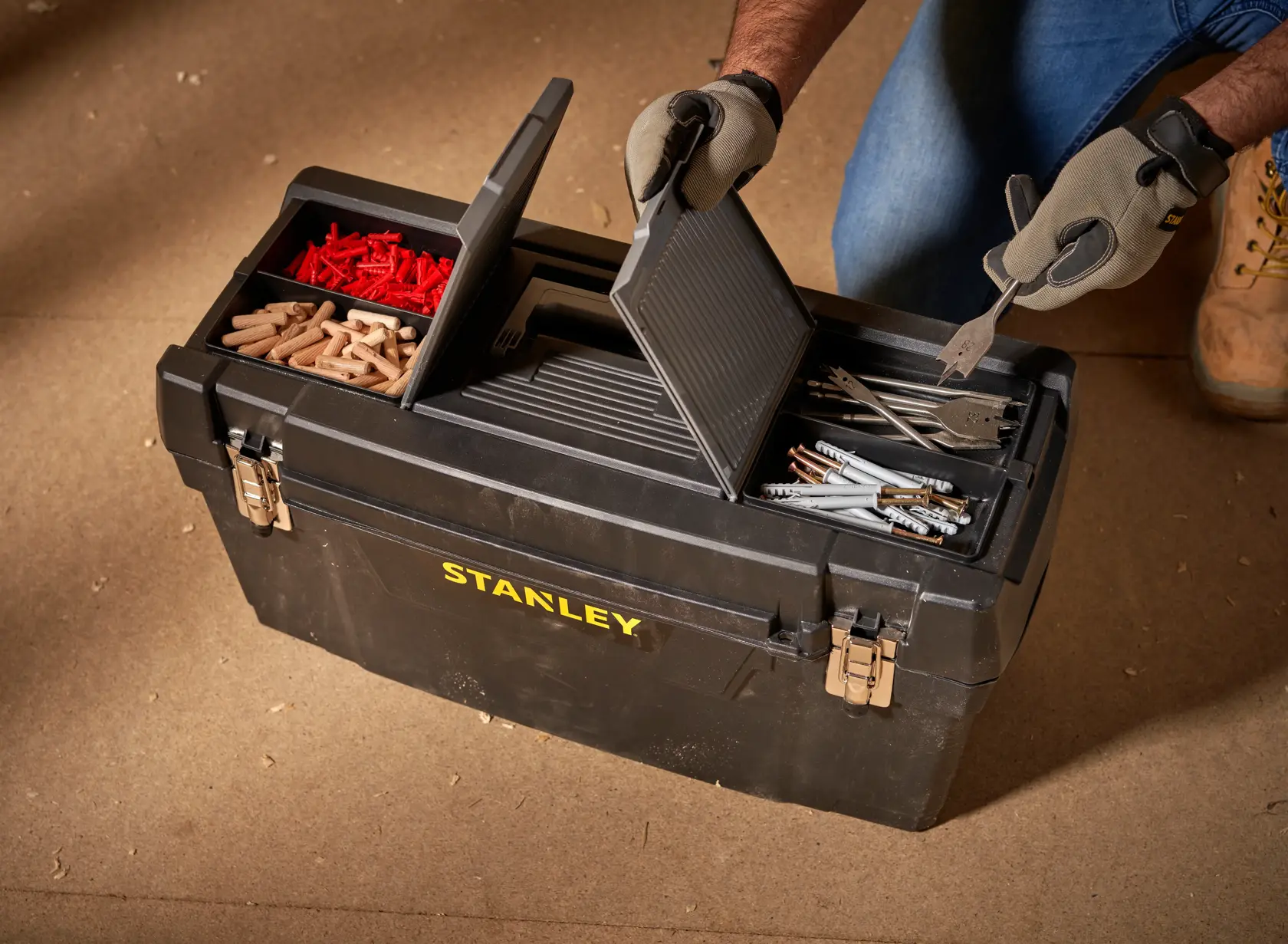 STANLEY 1-94-859 toolbox with compartments open, showing assorted fasteners and hand tools, top view.