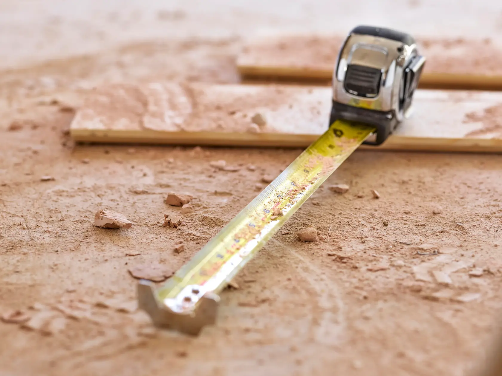 STANLEY 5-33-886 tape measure extended on a dusty work surface, close-up photography.