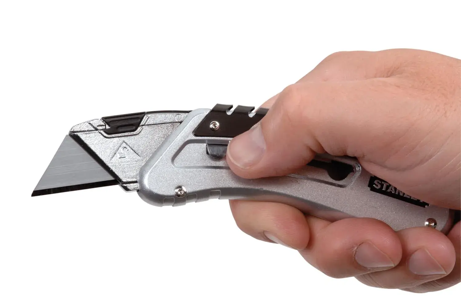 Photo of STANLEY 9-10-810 utility knife held in hand, silver metal body, angled blade, white background.