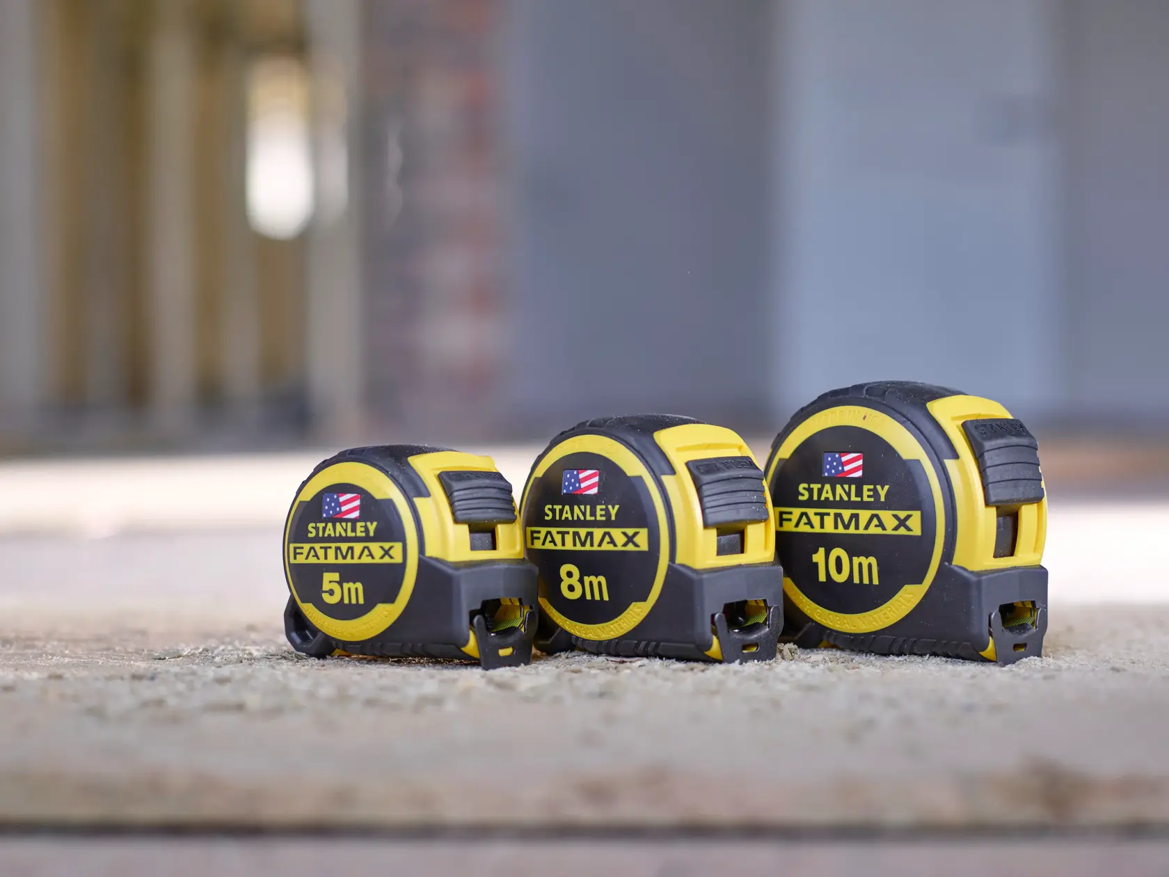 STANLEY FMHT0-36337 tape measures in 5m, 8m, and 10m sizes, yellow and black, shown side by side.