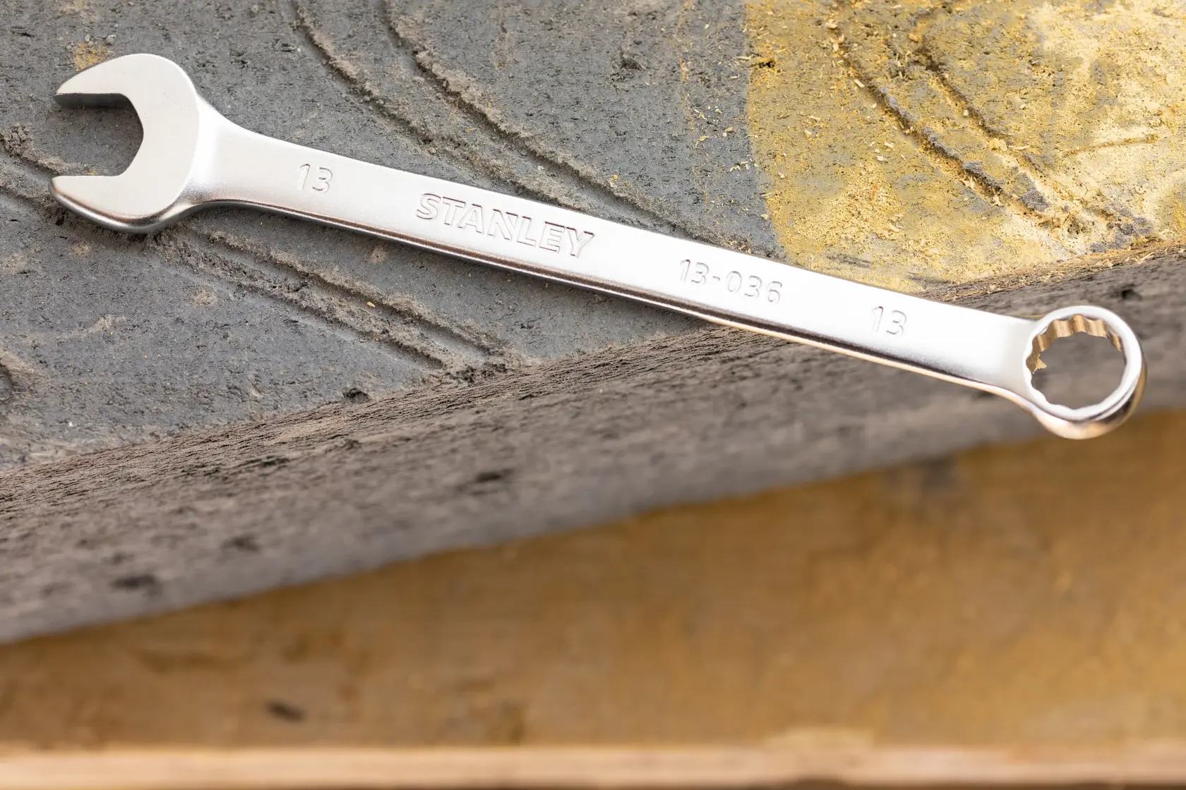 Stanley FMMT13036-0 combination wrench on textured stone surface, photography product category.