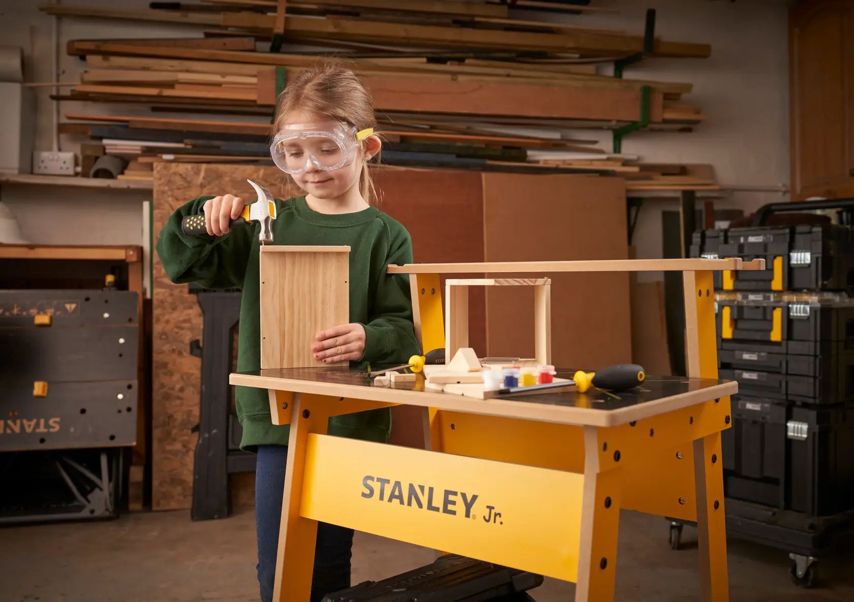 STANLEY K020-SY photography of a yellow STANLEY Jr. workbench with woodworking tools and a wooden project.