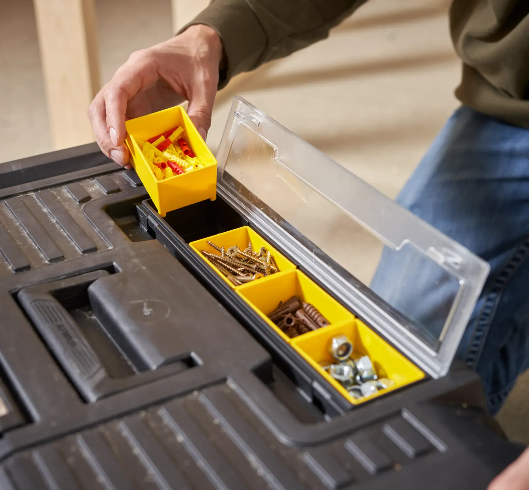 STANLEY STST1-70715 photography of black toolbox with yellow compartments holding screws and hardware.