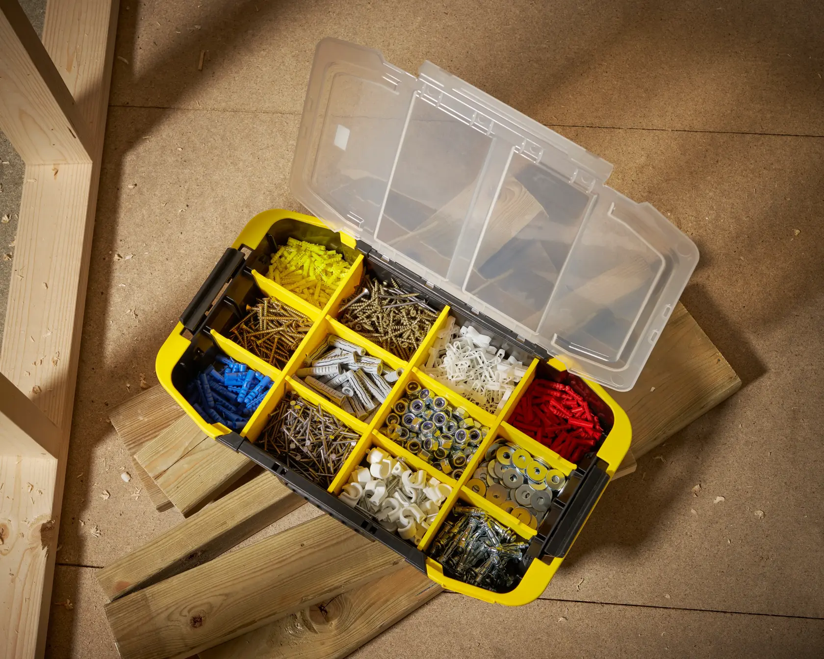 STANLEY STST1-71983 organiser box top view, yellow case with compartments for screws, anchors, and washers.