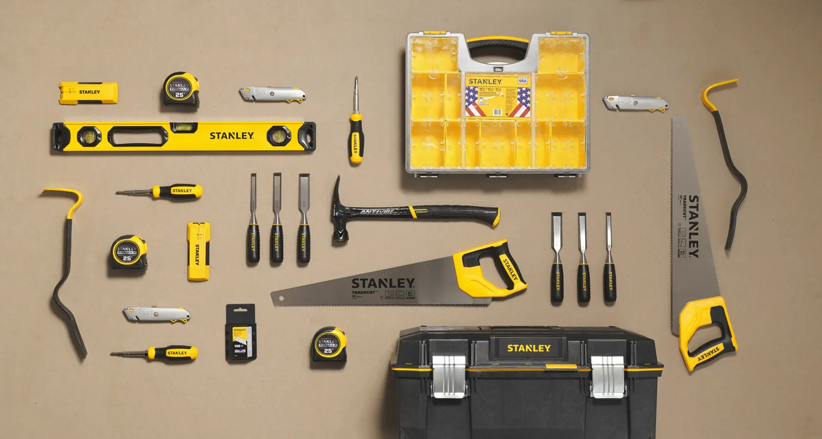 STANLEY 55-525 assorted hand tools set with toolbox, saw, level, tape measures, screwdrivers, and organizers, top view.